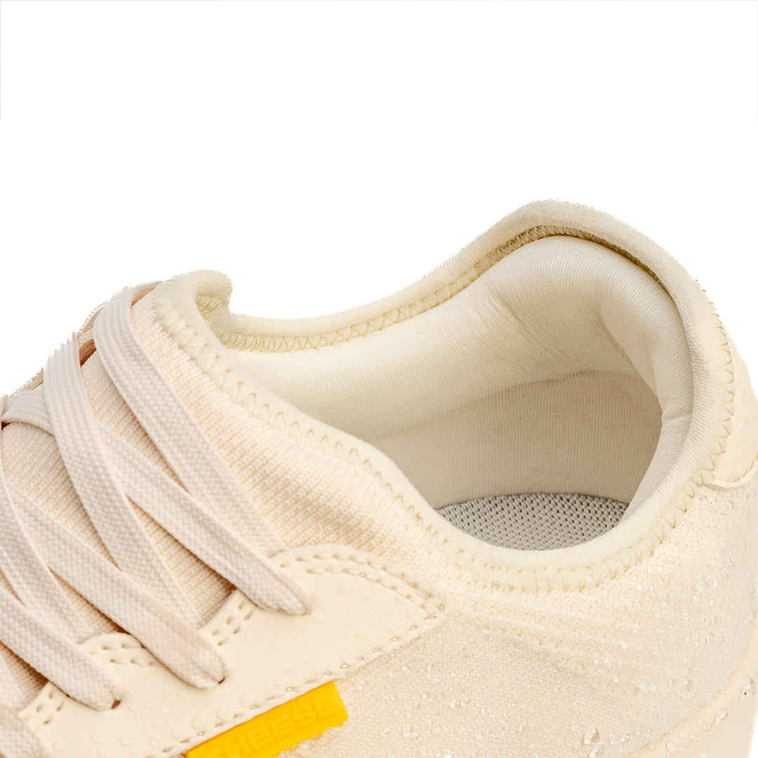 Theese Purpose waterproof shoe in vintage white zoomed in on collar cushion and heel support at the back of the shoe